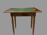 a small table with a green table top on it