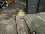 a pallet that is sitting on the ground in a garage