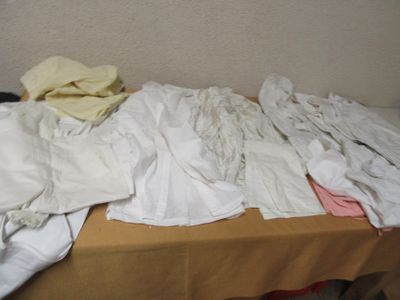 a table that has a bunch of clothes on it