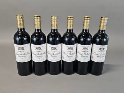 six bottles of wine are lined up in a row