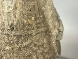 a close up of a vase with a face on it