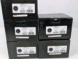 three boxes of black boxes are stacked on top of each other