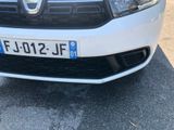 a white car parked on the side of the road
