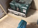 a blue tool box sitting on the floor next to a blue tool box