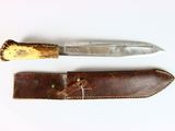 two knives that are sitting next to each other on a table