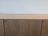a close up of a wooden cabinet in a room