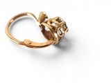 an image of a gold ring with a flower on top of it