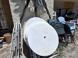 a lot of junk on the ground outside of a house