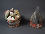 two figurines that are sitting next to each other