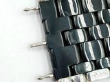 a picture of a black and white woven bracelet