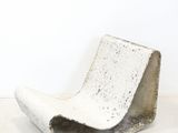 a white chair that is sitting in a room