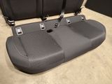 two seats in the back of a car that are empty