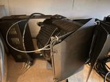 two televisions that are sitting next to each other on the floor