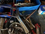 a bike that is sitting next to a bunch of tools