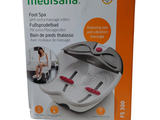 un carton contenant du matériel de spa pour les pieds, exposé à la vente