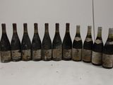 bottles of wine lined up in a row on a table