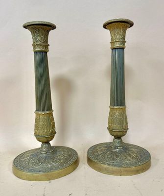 pair of antique brass candlesticks with green and gold pating