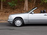 a silver car that is parked on the side of the road