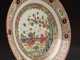 an image of a decorative plate with a deer and flowers on it