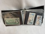three different canadian bank notes are in a wallet on a white surface