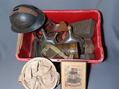 a red box filled with old items on a blue surface