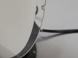 a black and white photo of a lamp on a table