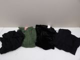 three pairs of black and green pants laying on top of a white table