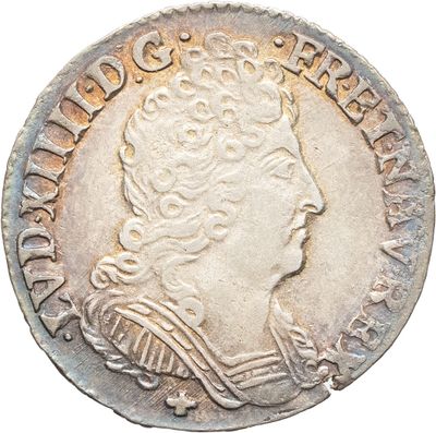 gros plan d'une pièce de monnaie sur laquelle figure une tête de femme