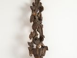 an antique wooden wall sconce with a bird and flower design