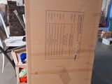 a cardboard box sitting on top of a pallet in a warehouse