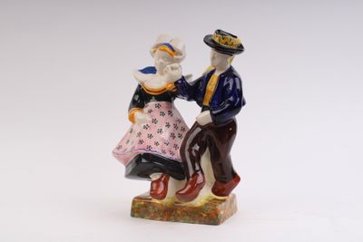 a figurine of a man and a woman dancing