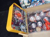 batman pinball game in a cardboard box on a black surface