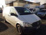 a white van that is parked in a parking lot