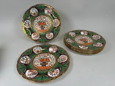 four pieces of decorative plates with flowers on them sitting on a table