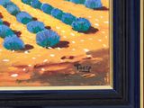 a painting of a field of blue flowers in a black frame