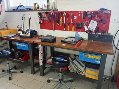 a workbench with tools on it in a garage