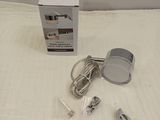 an image of a box of electrical items on a bed