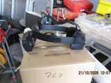 a box with a watch on top of it and a cart with luggage