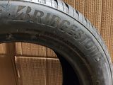 a close up of a tire with a box in the background