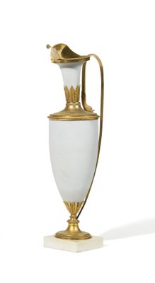 a white and gold vase with a bird on it