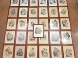 a lot of framed pictures on the floor of this room