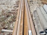 several pieces of wood are stacked on top of each other in a field