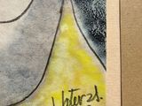 a picture of a painting of a woman ' s face on a piece of paper