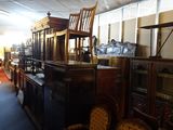 a room with a lot of antique furniture in it