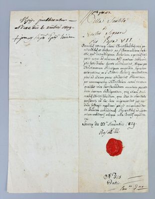 a piece of paper with a red wax stamp on it