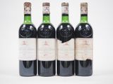 trois bouteilles de vin sont alignées sur une surface blanche