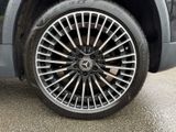 a close up view of a car ' s wheel on the road
