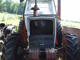 a tractor that is parked in the dirt