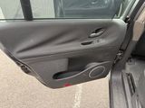 a car door open with the driver ' s side door open