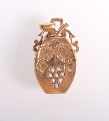 an image of a gold locke with pearls on a white background